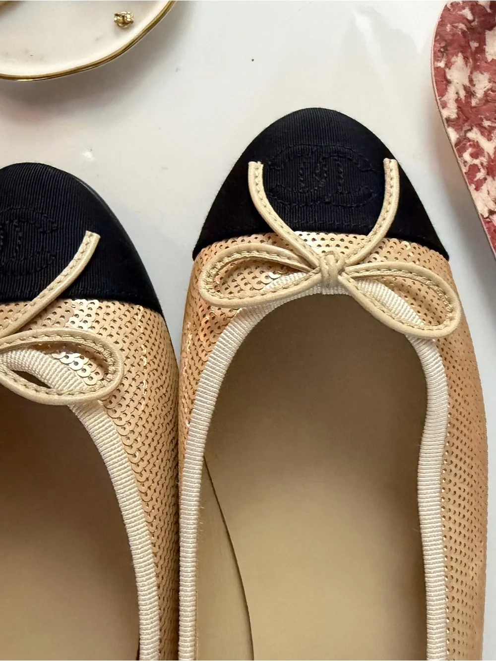 CHANEL Beige and Black Cap-Toe Ballet Flats with Bow